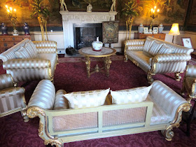 The Tapestry Room with 1820s giltwood furniture  and a white marble chimneypiece by Adam
