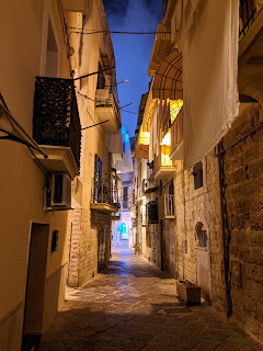Narrow street of Bari at night.