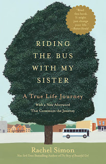 book cover, a tree with the title in the bough, and a bus on a street