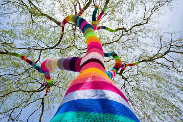 yarn bombing tree trunk branch yarn bomb