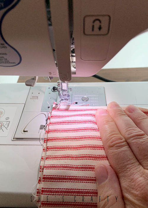 Sew flag on sewing machine.