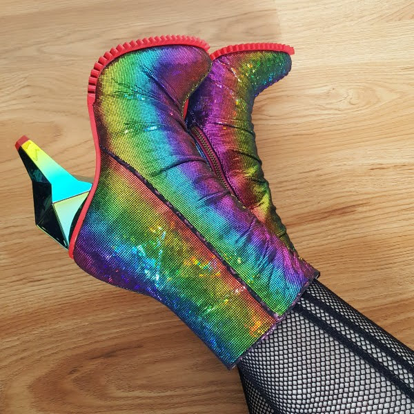 wearing rainbow striped metallic ankle boots with diamond shaped heel