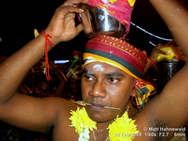 Thaipusam Festival, Malaysia, Kuala Lumpur, Batu Caves, kavadi attam, ceremonial sacrifice, ceremonial offering, Tamil man, Hindu man, Malaysian Indian man, street portrait, ritualised piercing, ritualised mutilation, self-mutilation