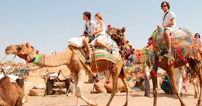 Sit on a camel’s back in Rajasthan