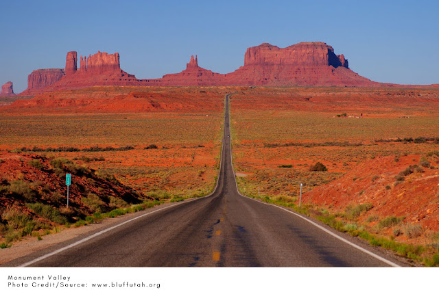 highway road stretching for miles to reach desert plateaus