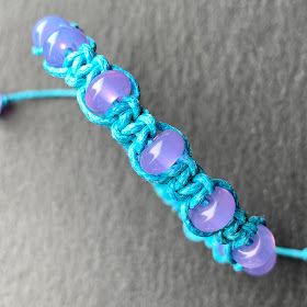 Handmade macramé bracelet with lampwork beads by Laura Sparling