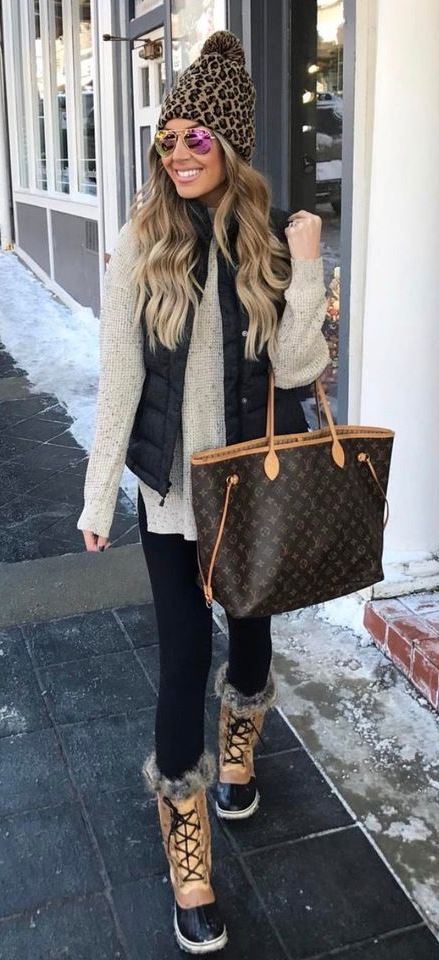 casual outfit idea / bag + nude sweater + knit hat + black vest + skinnies + boots