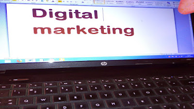 Digital marketing projected out of a computer screen.