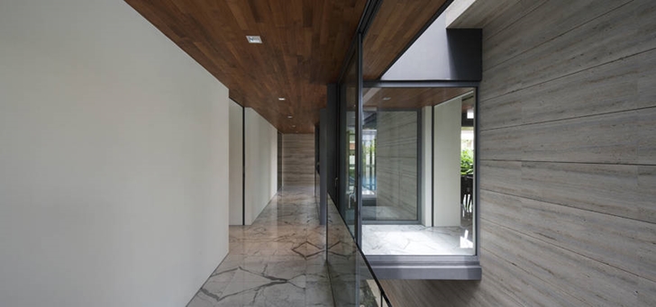 Hallway in Travertine Dream House by Wallflower Architecture + Design