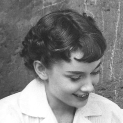 Roman Holiday curly cut It's a short layered cut with bangs