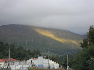 Sunlight in Porto de Mos mountain range photo - Portugal