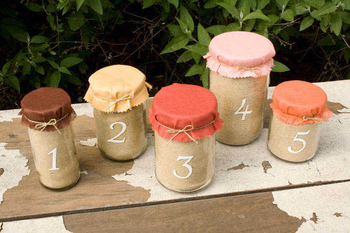 For a beach theme you can fill empty mason jars with sand