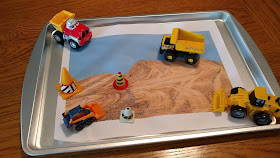 Printed scene with toy construction equipment