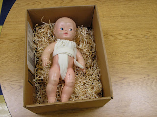 Swaddling clothes on doll (Brick by Brick)