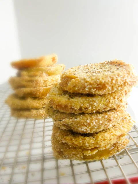 Fried Green Tomatoes, crispy on the outside tender and meaty on the inside.  Serve them as an easy appetizer or stack them for an elegant side dish.