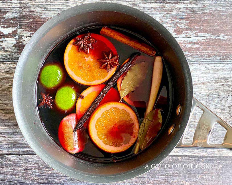 Mulled wine pictured in a saucepan with spices.