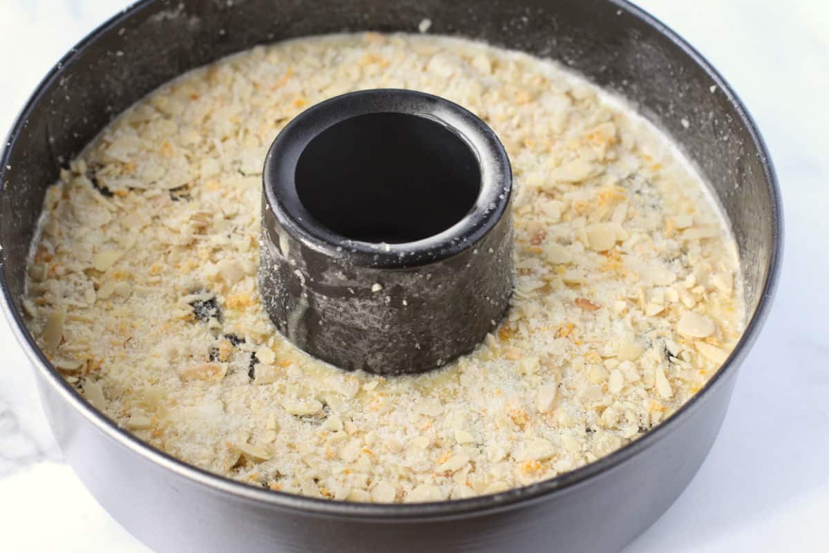 Rustic Grape and Almond Paste Cake batter in pan with topping before baking.