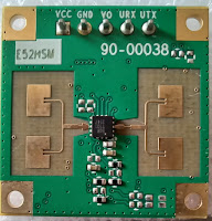 RF side of HLK-LD1115H 24 GHz radar module. Note how small the chip is as compared to the standard 0.1" pin header visible on top.