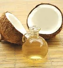 acne under the skin. Coconut halves with coconut oil bottle