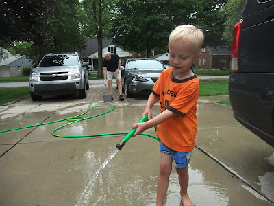 jack watering the driveway, washing cars