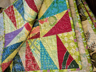 Sawtooth border and feather quilting details