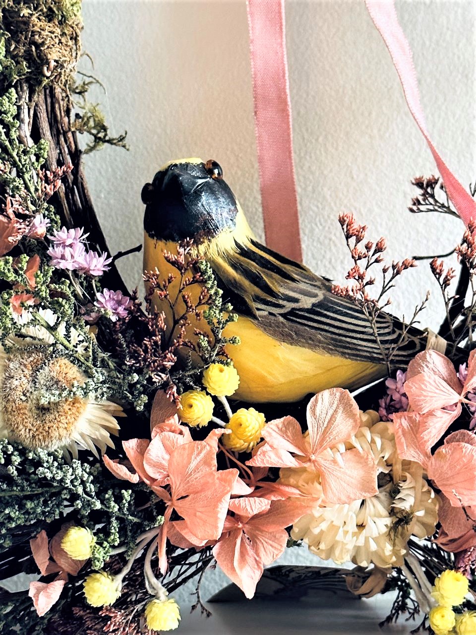 American Gold Finch in dried flower wreath