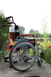 pimped manual wheelchair with striped fabric and painted sides