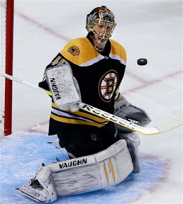 Tuukka Rask watches the puck