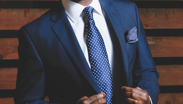 Photo of man in suit by olu eletu