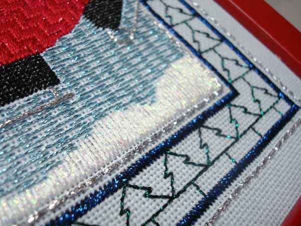 Use Kreinik Ombre in 3200 Pearl for snow drifts in needlepoint