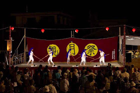 martial arts performance on stage at night