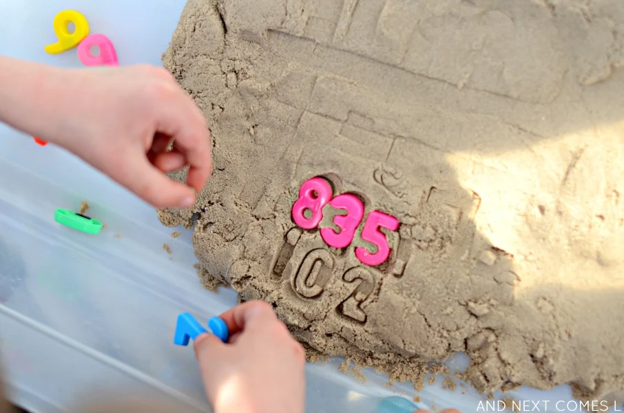 Stamping numbers in kinetic sand