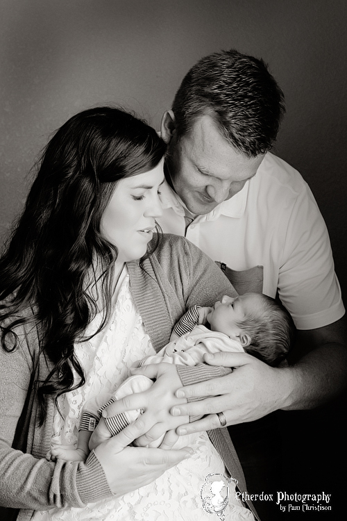 Professional portrait of a family with a newborn baby