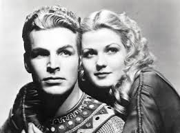 A photographic portrait of Buster Crabbe as Flash Gordon and Jean Rogers as Dale Arden.