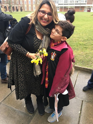 Woman and small child dressed as Harry Potter character 