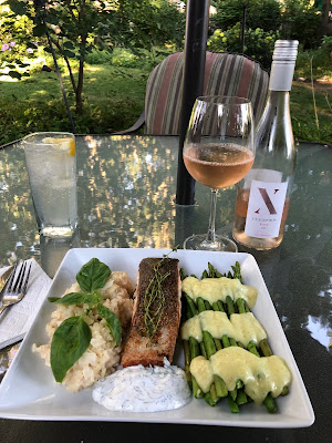 Crispy skin Scottish pearl salmon with dill cream, risotto and asparagus with hollandaise