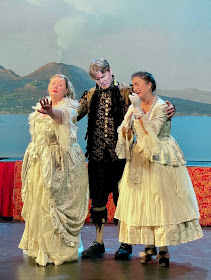 IN REVIEW: (from left to right) soprano MEREDITH HANSEN as Fiordiligi, bass DENIS SEDOV as Don Alfonso, and mezzo-soprano LISA CHAVEZ as Dorabella in Opera in Williamsburg's 2022 production of Wolfgang Amadeus Mozart's COSÌ FAN TUTTE [Photograph by Roxane Revon, © by Opera in Williamsburg]