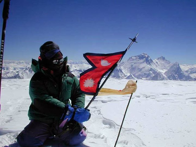 Nepali national flag on the top of mount everest