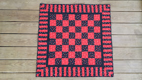 Red and black checkerboard checkers quilt