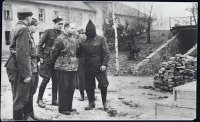 Rudolf Höss walking to the gallows next to the crematorium in the Nazi death camp  of Auschwitz Birkenau in Poland.