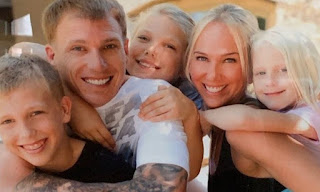 Denika Kisty with her husband Jason and their kids