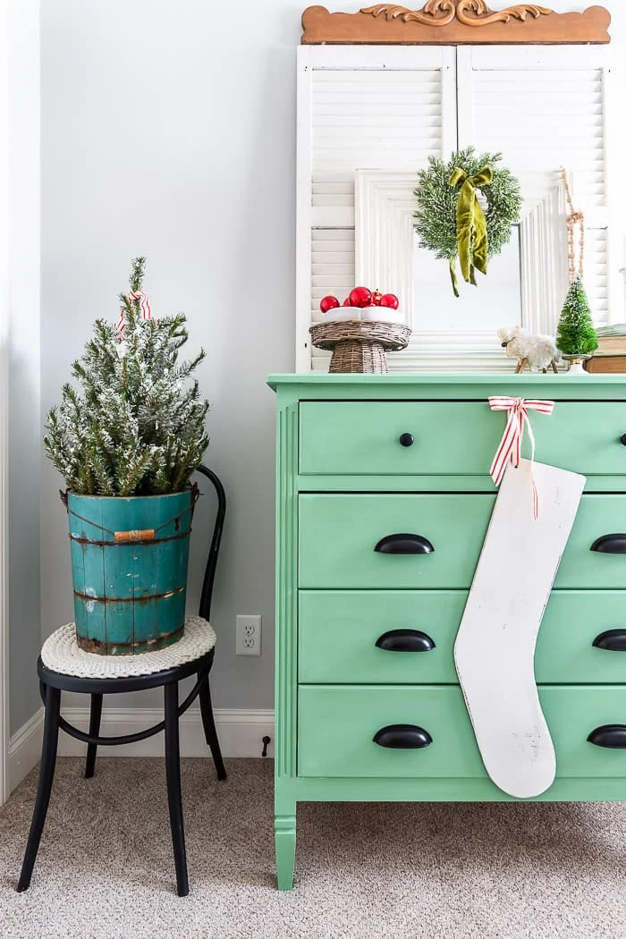 antique blue ice cream churn, cottage green dresser, shutters, wood stocking