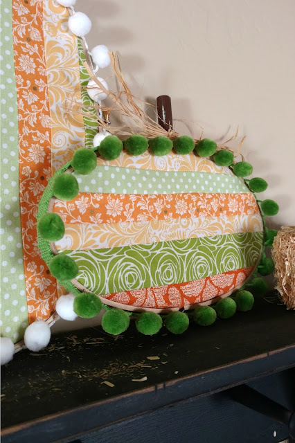 Embroidery hoop pumpkins made with oval hoops make for a fun and unique piece of fall decor!