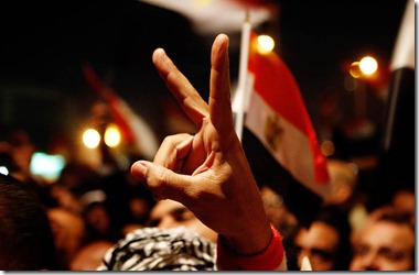 CAIRO, EGYPT -- THURSDAY, FEBRUARY 10, 2011 --  An Egyptian protestor holds up a peace sign as hopes were up that President Mubarak would resign during his anticipated speech.  ( Rick Loomis / Los Angeles Times )