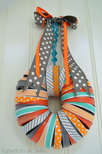 http://tatertotsandjello.com/2013/09/halloween-mason-jar-washi-tape-wreath.html