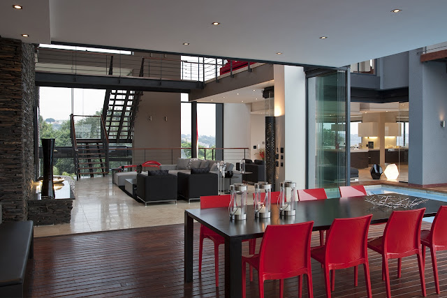 Picture of black table and red chairs on the covered terrace