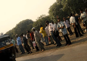 Men waiting for bus