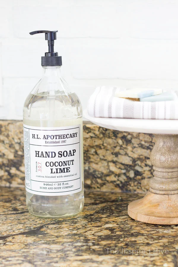 Ideas for farmhouse kitchen decor. Apothecary soap. Use a cake stand for soaps and dish towels.