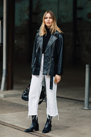 Cool Way to Wear White Jeans for Winter — Street Style Outfit Idea With Belted Long Leather Jacket, Black Turtleneck Sweater, Frayed White Jeans, and Black Leather Ankle Boots