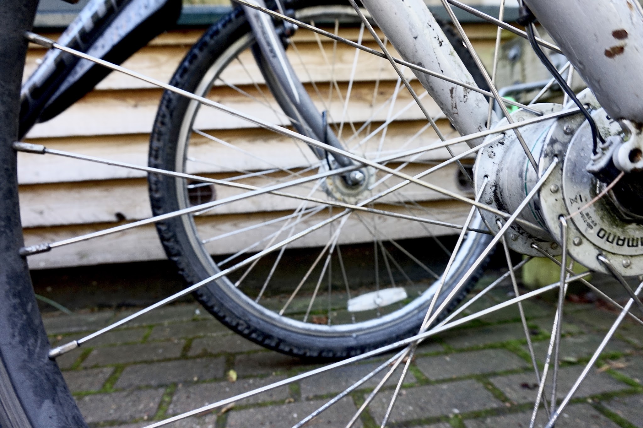 two bike wheels showing bike spokes